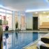 Hotel Ulmenhof & Spa in Bredstedt indoor pool with loungers and spa seating