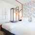 ibis Styles Paris Eiffel Cambronne room with twin beds and colorful geometric wall art in Paris