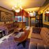 New Hotel Kuc by Marvel in Sveti Stefan: warm lobby with tufted sofas, chandelier and marble flooring