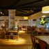 Resort Bad Boekelo in Boekelo dining room with wooden tables, chairs, and warm pendant lighting