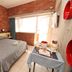 Hotel Marina in Marina di Massa room with brick walls, double bed, balcony door and breakfast table