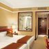 Rosedale Hotel Shenyang room in Shenyang with twin beds, desk, wall-mounted TV and bathroom window