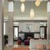 Hilton Garden Inn Riverhead lobby with fireplace, hanging pendant lights and seating area