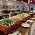 Henry Morgan Hotel & Beach Resort in Coxen Hole buffet with salads, vegetables, and plated dining area