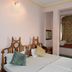 Hotel Harasar Haveli in Bikaner guest room with twin beds and a window seat nook