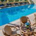 Esmeralda Hotel in Kremastí with outdoor pool and patio seating