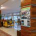 Hotel Behounek in Jáchymov lobby with seating area, wood-paneled columns, and large windows