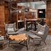 Cleveland Marriott East lounge in Warrensville Heights with gray chairs, wood tables, and bar seating