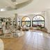 Sol Sancti Petri lobby in Chiclana de la Frontera with arched windows, lounge chairs and tiled floors