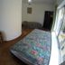 Mar de Cortez in Cabo San Lucas guest room with two beds, tiled floor, and sliding glass door