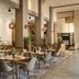 Hilton Scottsdale Resort & Villas in Scottsdale restaurant with indoor-outdoor dining and tall columns