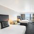 Hilton Motif Seattle guest room with two beds and waterfront view of Seattle