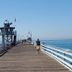 Casa Tropicana in San Clemente: long wooden pier over the ocean with railings and a watchtower