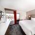 Comfort Inn & Suites Wyomissing/Reading guest room with king bed, desk and window view in Wyomissing