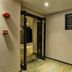 Dunhe Apartment Guangzhou hallway with glass entrance doors and directional sign