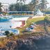 Golden Tulip Dar Es Salaam coastal hotel with cliffside pool, sun terrace and palm trees