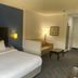 Comfort Inn & Suites Trussville I-59 Exit 141 room with king bed, sofa seating and lamp