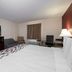 Red Roof Inn Warrenton hotel room in Warrenton with king bed, TV, sofa and desk