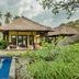 Amertha Bali Villas in Gerokgak with thatched villas and a blue pool amid tropical landscaping