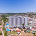 Sol Milanos Pingüinos in Son Bou with beachfront views, outdoor pools, and coastal hillside backdrop