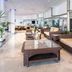 Sol Milanos Pingüinos Son Bou lobby lounge with wicker sofas and glass coffee table
