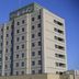 Hotel Route-Inn Nagaoka Inter in Nagaoka, mid-rise hotel exterior against a clear blue sky