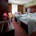 Treacy's Hotel in Enniscorthy guest room with two twin beds, desk, and window with curtains