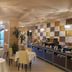 Hotel La Cartiera in Vignola dining room with set tables and buffet counter