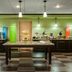 Hampton Inn Lincoln-South/Heritage Park breakfast area with buffet counters and central serving table in Lincoln