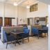 Holiday Inn Express & Suites White River Junction lobby seating area with tables and bar stools
