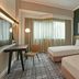 Vibe Hotel Singapore Orchard guest room with two beds and window seating in Singapore