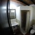 Mar de Cortez in Cabo San Lucas bathroom with sink, toilet, and walk-in shower under exposed beams
