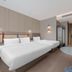 Motel Shanghai Liuzhou Road Guangda Convention And Exhibition Centre guest room with three beds in Shanghai