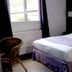 Logis Hôtel Restaurant Auberge Saint Martin room in Saint-Gatien-des-Bois with bed, window and chair