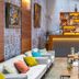 Charm Hotel Budapest bar lounge with sofas, tables and illuminated back bar in Budapest
