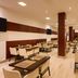Hotel Dei Cavalieri Caserta dining room with neatly set tables and cream chairs in Caserta