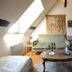 Chateau De Jallanges attic suite in Vouvray with twin beds, sofa, and coffee table