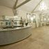 Ravenwood Hall Hotel in Bury St. Edmunds ballroom with bar, chandeliers and banquet seating