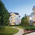 Club Wyndham Nashville courtyard with landscaped path and lit balcony hotel buildings at dusk