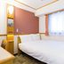 Toyoko Inn Takamatsu Hyogomachi guest room with a double bed and window in Takamatsu