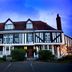 Marygreen Manor Hotel in Brentwood, timber-framed manor house exterior at dusk