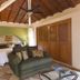 Villa Bella Bed & Breakfast Inn in La Cruz de Huanacaxtle room with canopy bed, sofa and wood ceiling