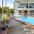 Aristotles North Shore in Auckland features a small outdoor pool with patio seating and balcony views.