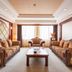 Grand View International Hotel Liaoyang luxury suite with ornate seating and coffee table