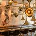 Motel One München-Westend lounge in Munich with leather banquette, brass horn lights and wall mural