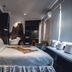 Ambre Epices Medina Riad in Marrakech guest room with bed, sofa seating, and ornate bathroom arch