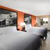 Super 8 by Wyndham Bulls Gap Greeneville Area room with two beds, TV, desk and window view