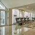 H+ Hotel Wiesbaden Niedernhausen lobby lounge in Niedernhausen with seating and large windows