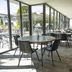 Campanile Troyes Nord - Barberey dining area with glass walls and patio tables in Barberey-Saint-Sulpice