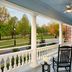 Inn at Carnall Hall in Fayetteville porch with rocking chairs overlooking a park